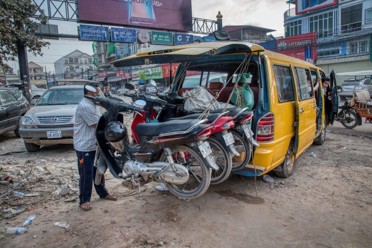 Phnom Penh street traffic — the bag-snatching risk is real, the fix is simple: don't carry your phone openly
