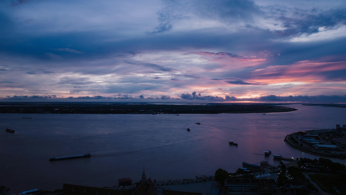 Sisowath Quay at dusk — the riverfront promenade at its best, when the heat drops and the city comes out